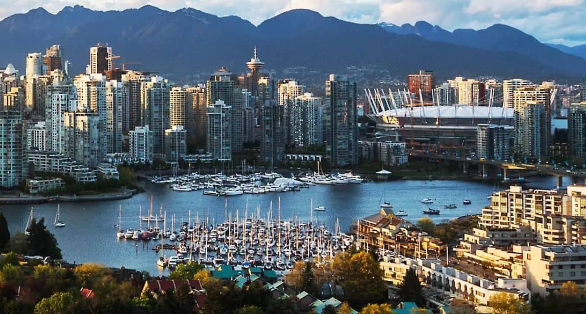 Vancouver skyline with harbor and mountains.