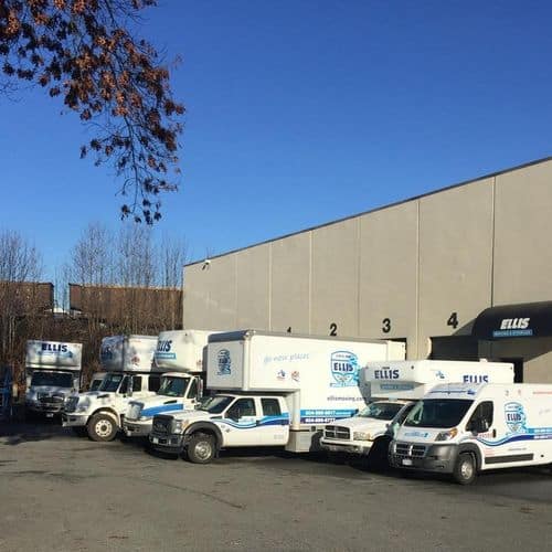 Fleet of moving trucks at warehouse location
