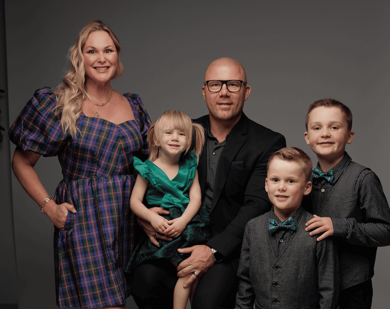 Family posing in coordinated outfits